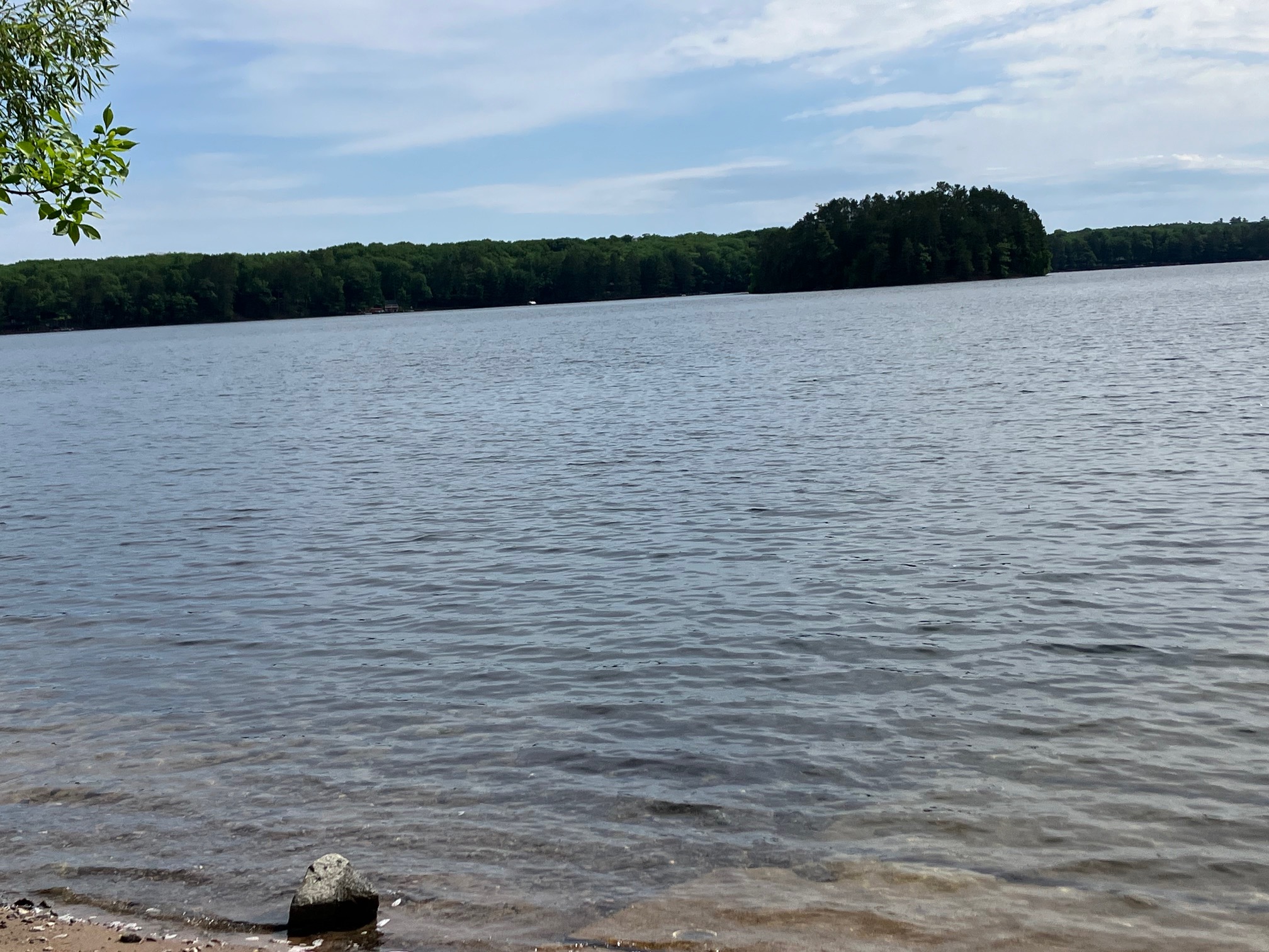 A quiet lakeside dock in the early morning, perfect for a peaceful Northwoods stay
